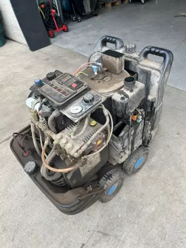 Dirty and worn Edge Panther pressure washer prior to service and repair, showing condition before maintenance work.